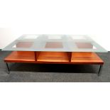 A designer contemporary glass topped coffee table, 120 x 70 x 35cm.