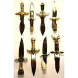 A collection of eight decorative daggers, L. 40cm.