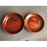Two mid 20thC Chinese turned wooden platters with red lacquer and gilt decoration, used as