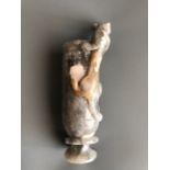 An impressive archaic form white and grey jade wine goblet with integral foot ring and young