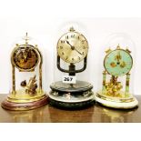 Two vintage enamelled torsion pendulum clocks with glass domes and a vintage Bulle clock with magne