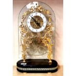A 19th century gilt and glass skeleton clock, H. 51cm. Condition : incomplete as seen in the