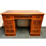 A pine leather topped desk, 120 x 61 x 80cm.