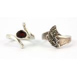 A 925 silver and marcasite ring together with a silver garnet set ring, (Q.5 & M).