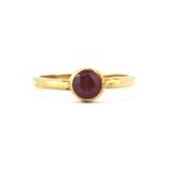 A 9ct yellow gold ruby set ring, (L).