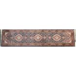 A dark blue brown heavy quality wool runner, W. 74cm L. 300cm.