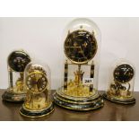 Four vintage enamelled torsion pendulum clocks three with plastic domes one with glass, tallest