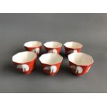 Matching the previous lot, a rare set of six octagonal porcelain tea cups each decorated with a