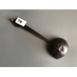 An 18th/ 19thC Tibetan hammered steel ladle used for yak butter candles and lamps. L. 24cm.