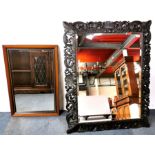 An ornately carved oak framed mirror, 130 x 100cm, together with a further mirror.