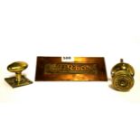An advertising brass letterbox and two advertising brass door handles, letterbox W. 21cm.