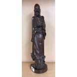 An unusual carved hardwood figure of an Arhat, H. 45cm. Condition - Some filled age cracking and