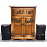 A carved oak record player cabinet with a Sony record player and speakers, 63 x 50 x 84cm.
