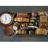 A box of mixed clocks, some mechanical some battery operated.