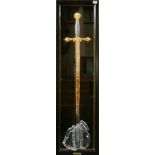 A large frame mounted Excalibur sword, frame size 40 x 130cm.