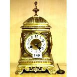 An early 20th century brass mantle clock with enamelled dial stamped Fritz (F) Marti, H. 29cm. Cond
