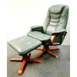 A revolving upholstered reading chair and footstool.