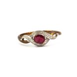 A 9ct yellow gold ruby and diamond set ring, (O.5).