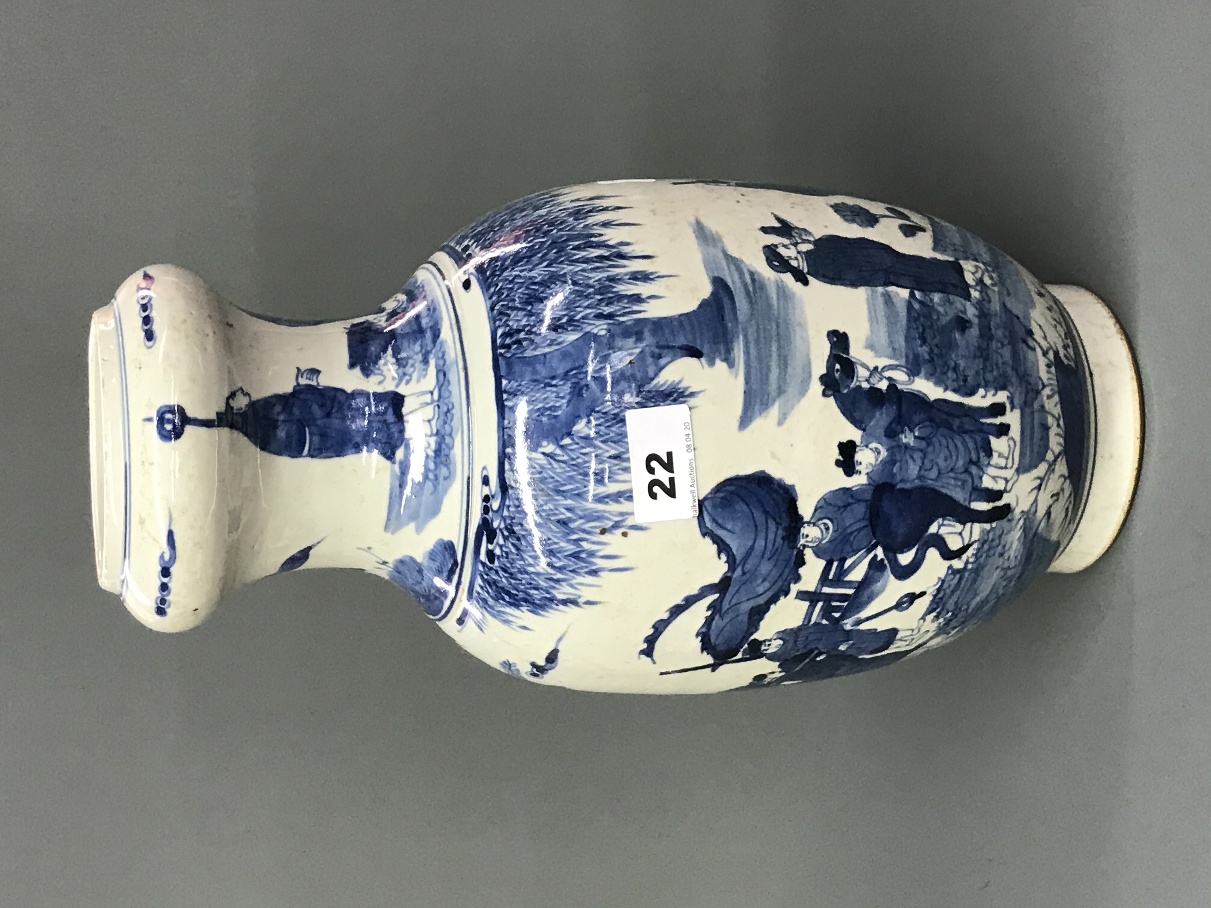 A Chinese hand painted porcelain vase with narrowed neck and decoration of an Emperor and advisers