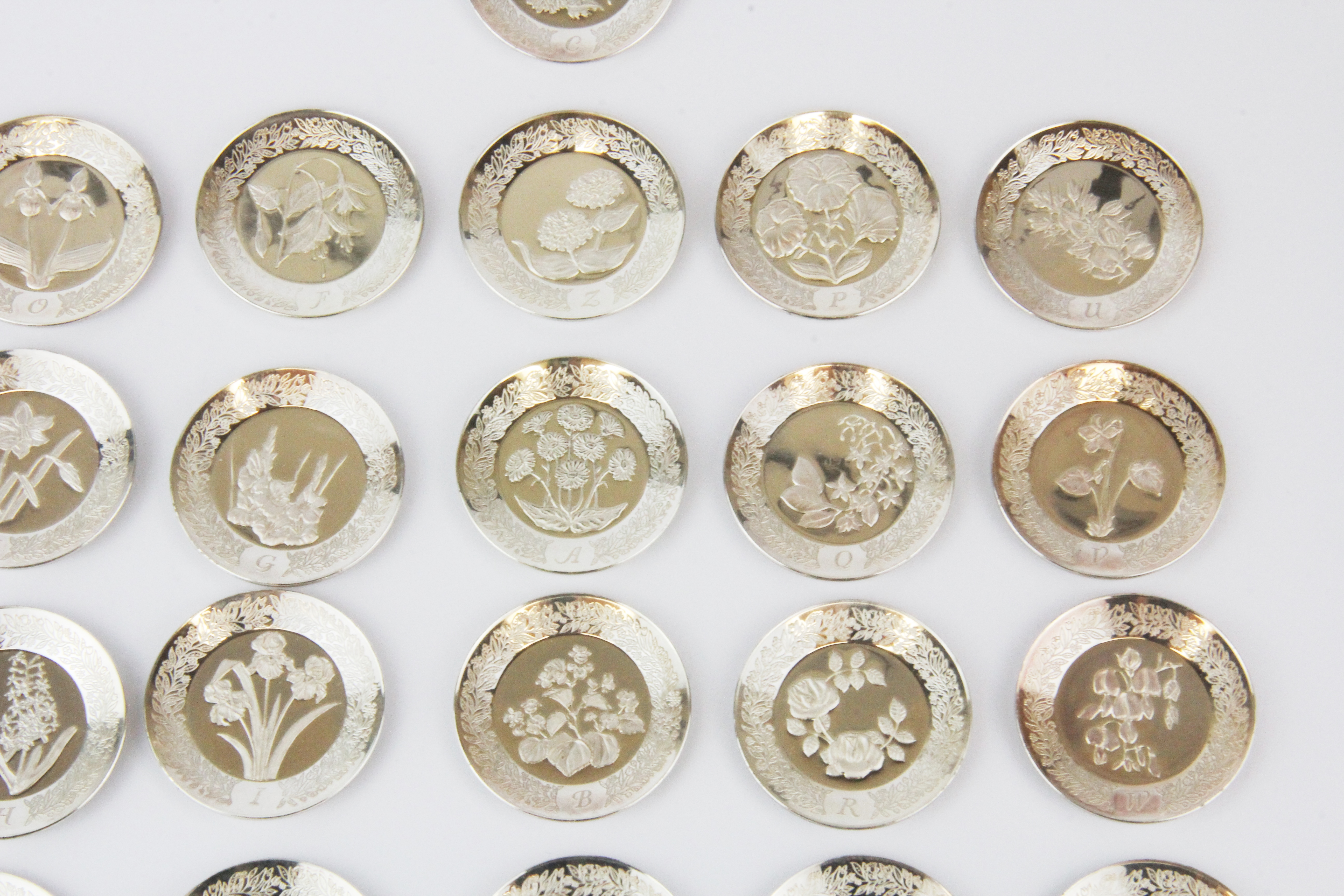 Twenty-six miniature sterling silver floral alphabet plate set, including the certificate of - Image 4 of 4