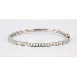 A 925 silver stone set children's bangle, L. 5cm.