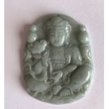 A finely carved jade amulet of the seated goddess Guanyin holding a ruyi. W. 4cms. Condition