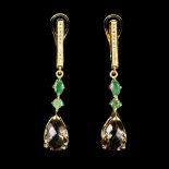 A pair of 925 silver gilt drop earrings set with a pear checker board cut smokey quartz and