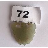 A small carved double sided jadeite jade butterfly pendant. H. 3.7cms. Condition good.