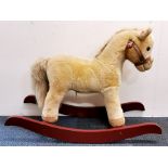 A vintage child's rocking horse, H. 59cm.