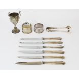 Two hallmarked silver napkin rings, hallmarked silver sugar tongs and a 1936 miniature hallmarked