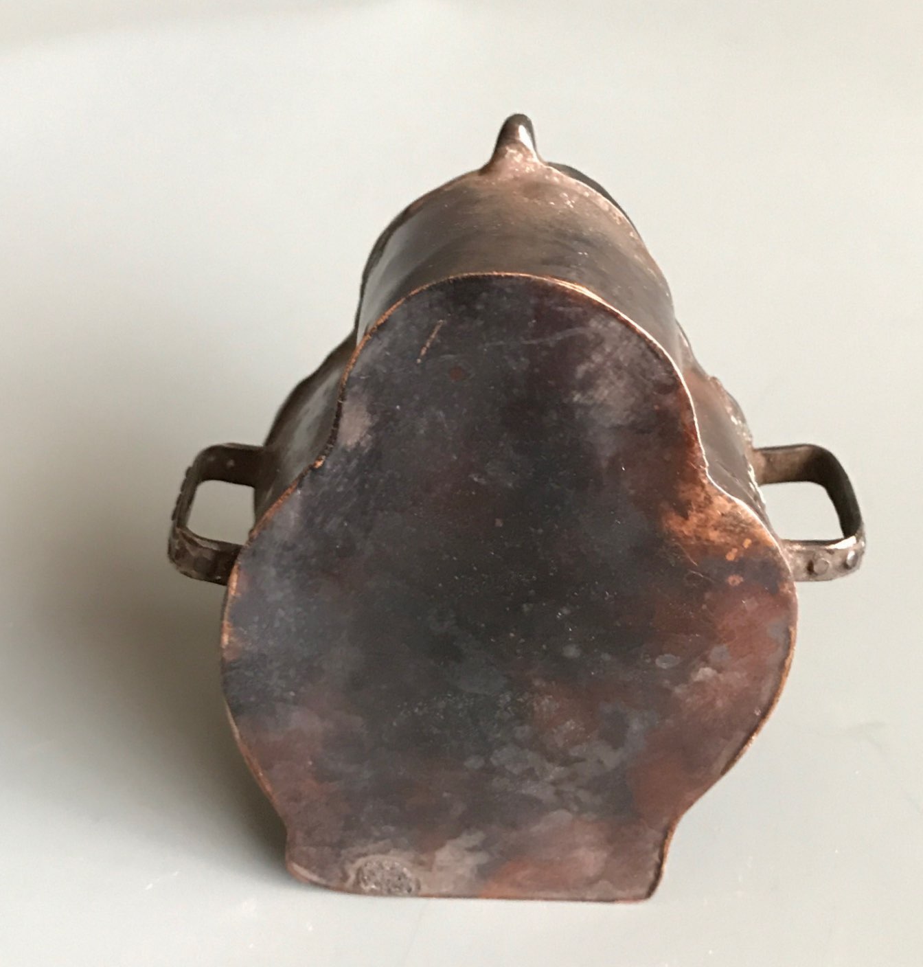 A Tibetan hammered copper and bronze fronted ga'u or portable shrine. H. 8cms. Condition good but - Image 3 of 3