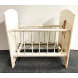An vintage white painted children's doll's cot, 60 x 40 x 60cm.