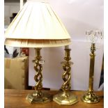 A pair of brass table lamps and shades and a further gilt brass lamp, tallest H. 68cm.