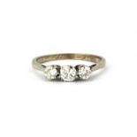 A platinum three brilliant cut diamond set ring, approx. 0.65ct.