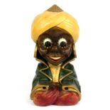 A vintage carved wooden and painted Aladdin alarm clock, H. 21cm. Condition - Currently not in