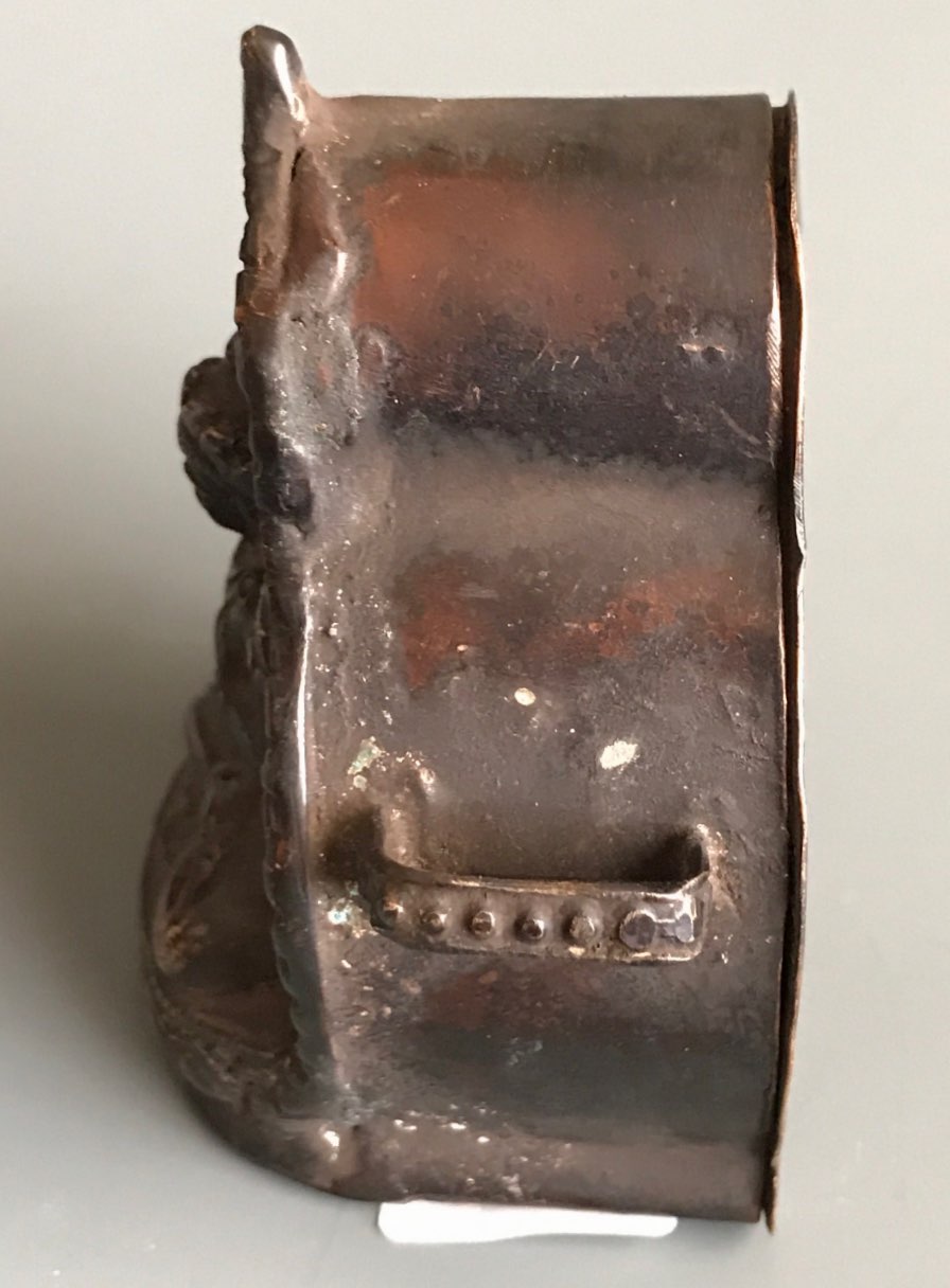 A Tibetan hammered copper and bronze fronted ga'u or portable shrine. H. 8cms. Condition good but - Image 2 of 3