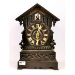 An early carved wooden Black Forest mantle cuckoo clock, H. 39cm. Condition - Requires attention.