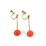 A pair of 1920's 9ct yellow gold coral set drop earrings, L. 3cm.