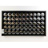 A tray containing a collection of 50 individually boxed gemstones, including rubies, opals,