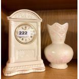 A Belleek porcelain clock and vase, clock H. 20cm.