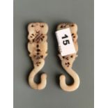 A pair of 19th/early 20thC carved nephrite jade/hardstone hooks. H. 10cms. Condition good but