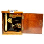 A 19th Century mahogany cased brass microscope, H. 32cm.