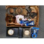 A box of clock cases and other items.