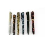 A group of five vintage fountain pens, four with 14ct gold nibs.