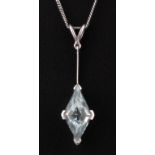 An 18ct white gold pendant and chain set with a fancy step cut aquamarine, L. 4cm.