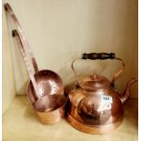 A copper kettle and ladle.