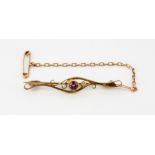 A boxed 9ct yellow gold (stamped 9ct) tourmaline and seed pearl set bar brooch, L. 4.5cm.