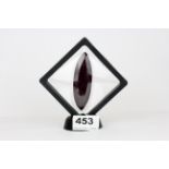 A large marquise cut natural ruby on a display stand, approx. 365.55ct.