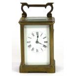 A striking gilt brass carriage clock, H. 14.5cm. Condition - Ticking but not for an extended