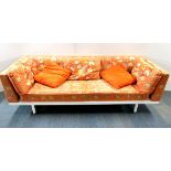 A 1970's upholstered bed settee with original patterned fabric, 220 x 76 x 70cm.